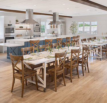 Large tables provide space to gather and enjoy nutritious meals.